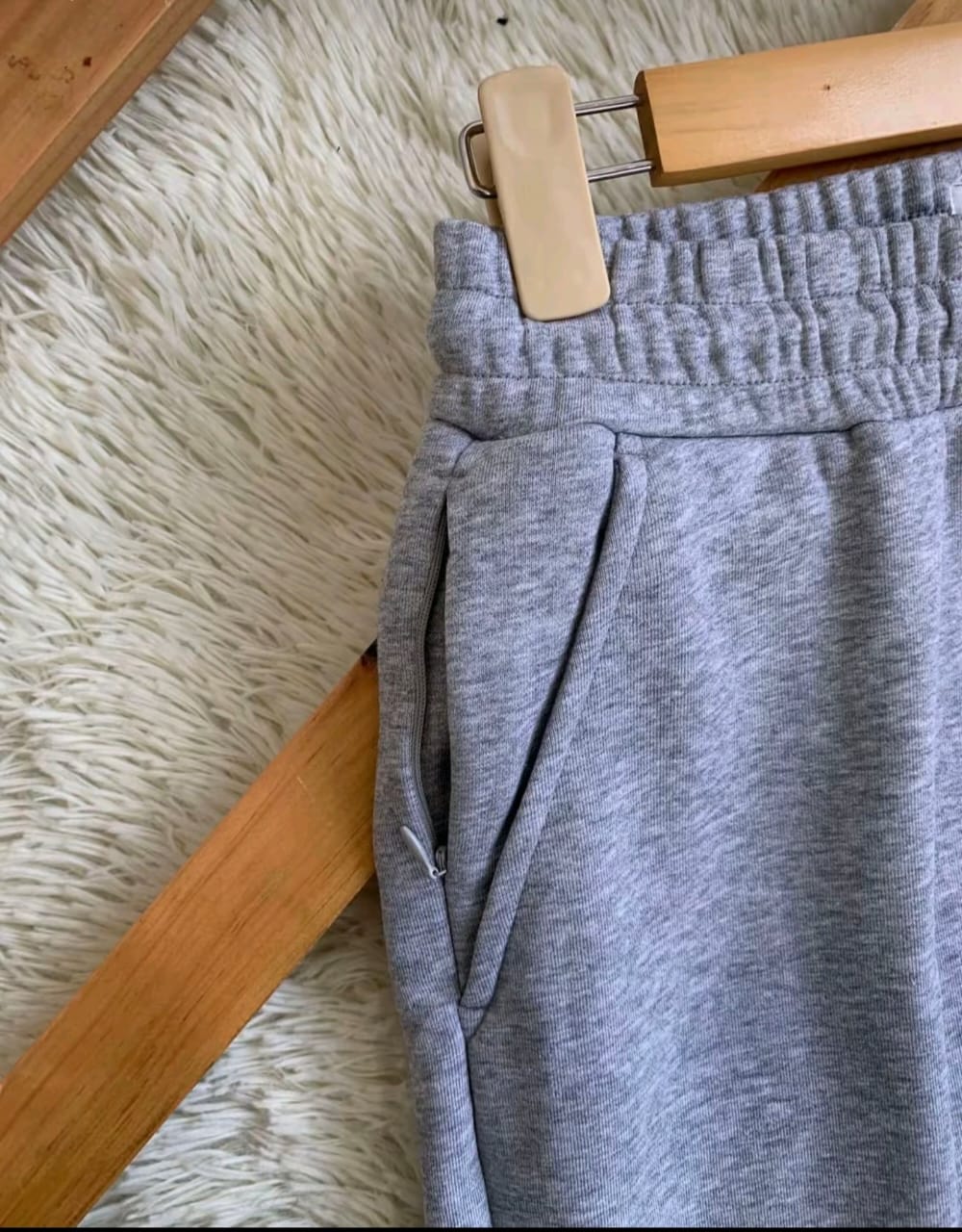 Close-up of elastic waist and zip pocket