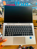 HP EliteBook 830 G8 open showing keyboard with Intel Core vPro badge and display