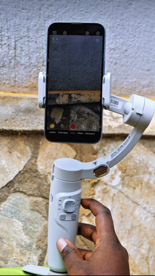 Gimbal stabilizer in use filming with smartphone