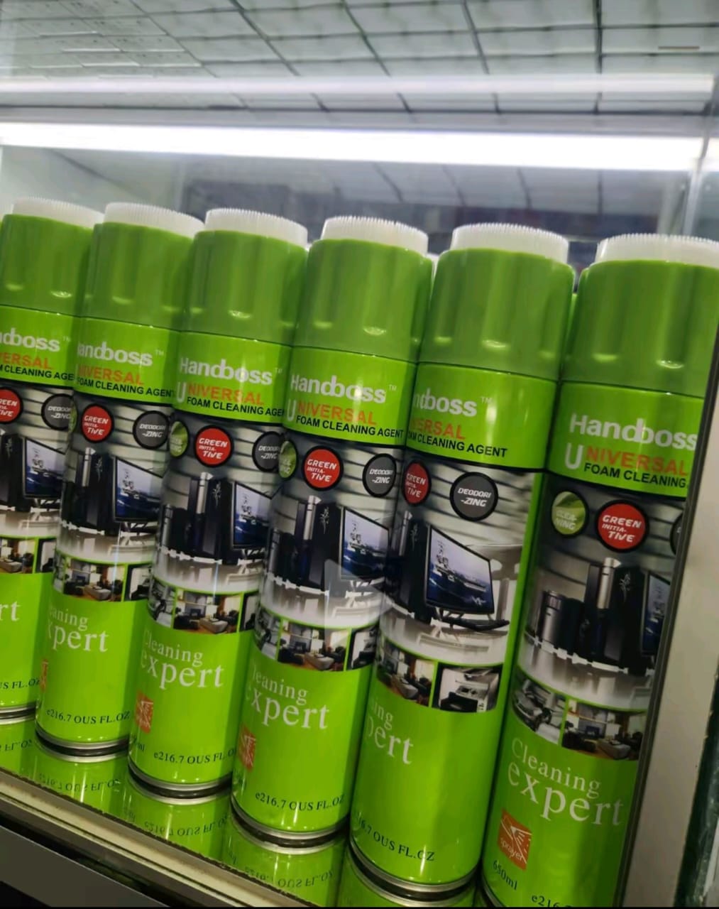 Two Handboss foam cleaner cans held up
