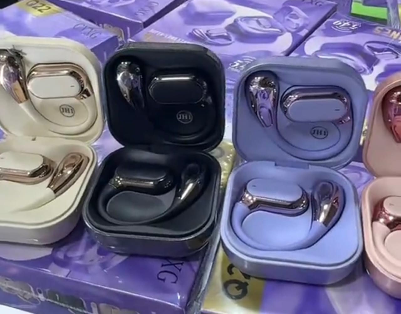 Q22 TWS Wireless Earbuds close-up in charging cases